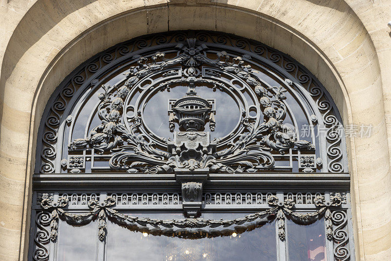 architectural detail of the tower of the Chamber of Commerce in the French city of Lille on the Place du Théâtre. The building was built between 1910 and 1921 and was designed by architect Louis Marie Cordonnier
